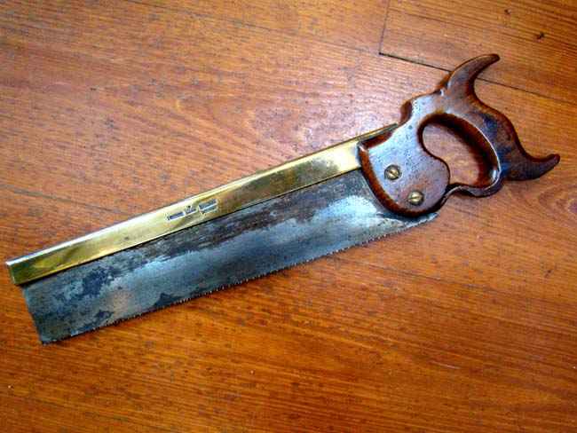A19th century brass mounted saw stamped "I.Hill Late Howel, LONDON"